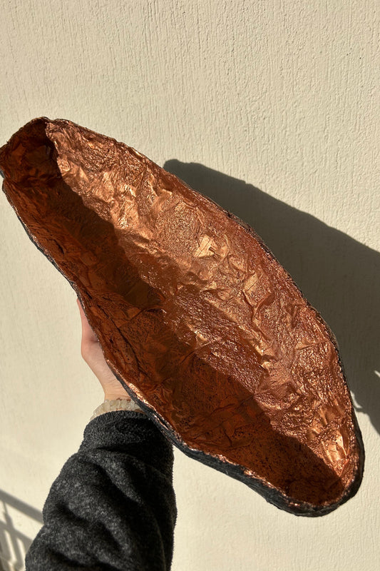 Side view of wabi sabi bowl held in hand, showing organic texture and shape.