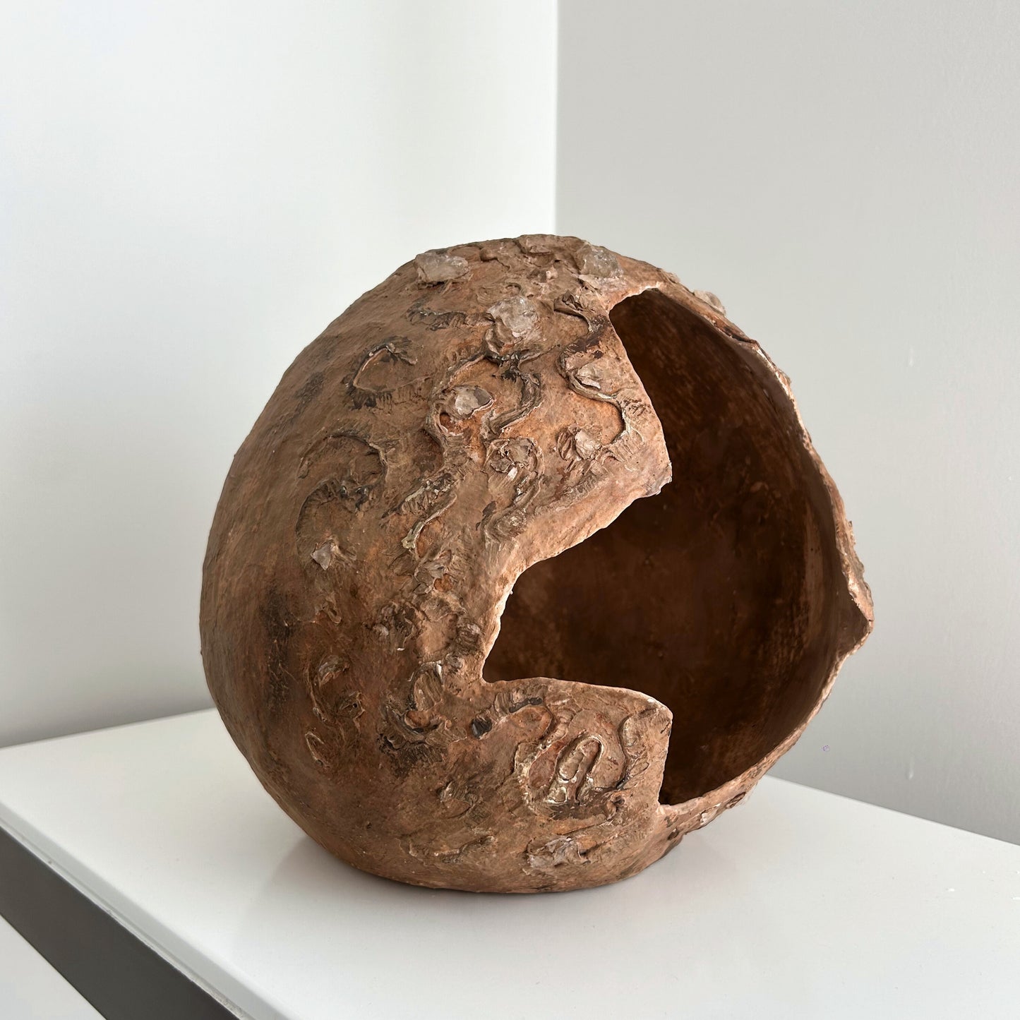 Hand-sculpted earthy brown vase with natural broken-edge design and embedded quartz stones