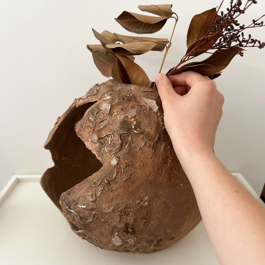 Wabi sabi decorative bowl styled with dried botanical leaves – rustic boho tabletop styling