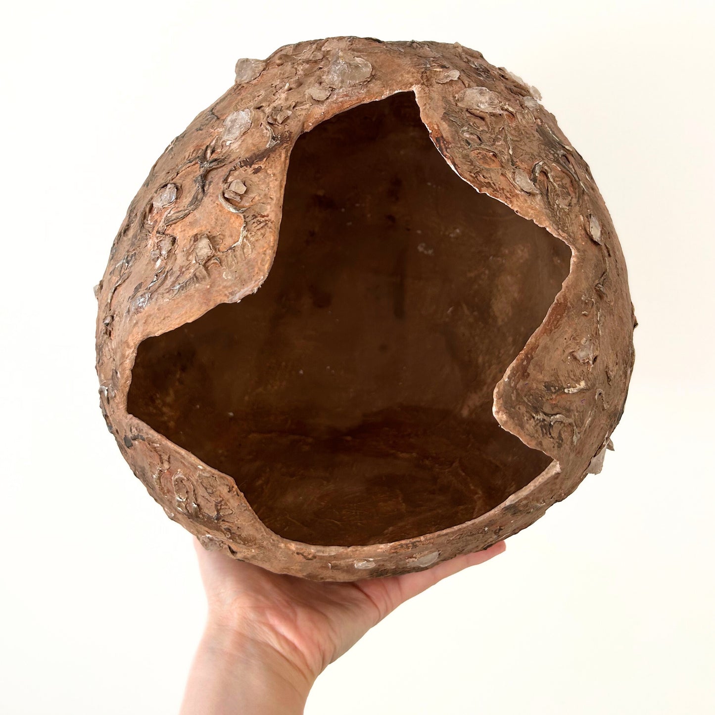 Interior view of a handcrafted wabi sabi vase in warm clay tones – rough opening and unique form