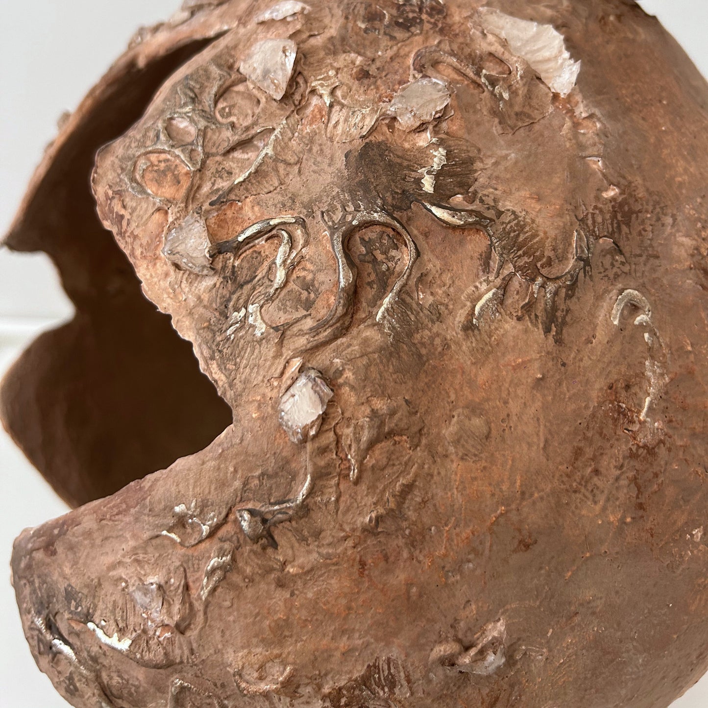 Textured relief surface of the handmade wabi sabi vase – showcasing crystal stones and carvings