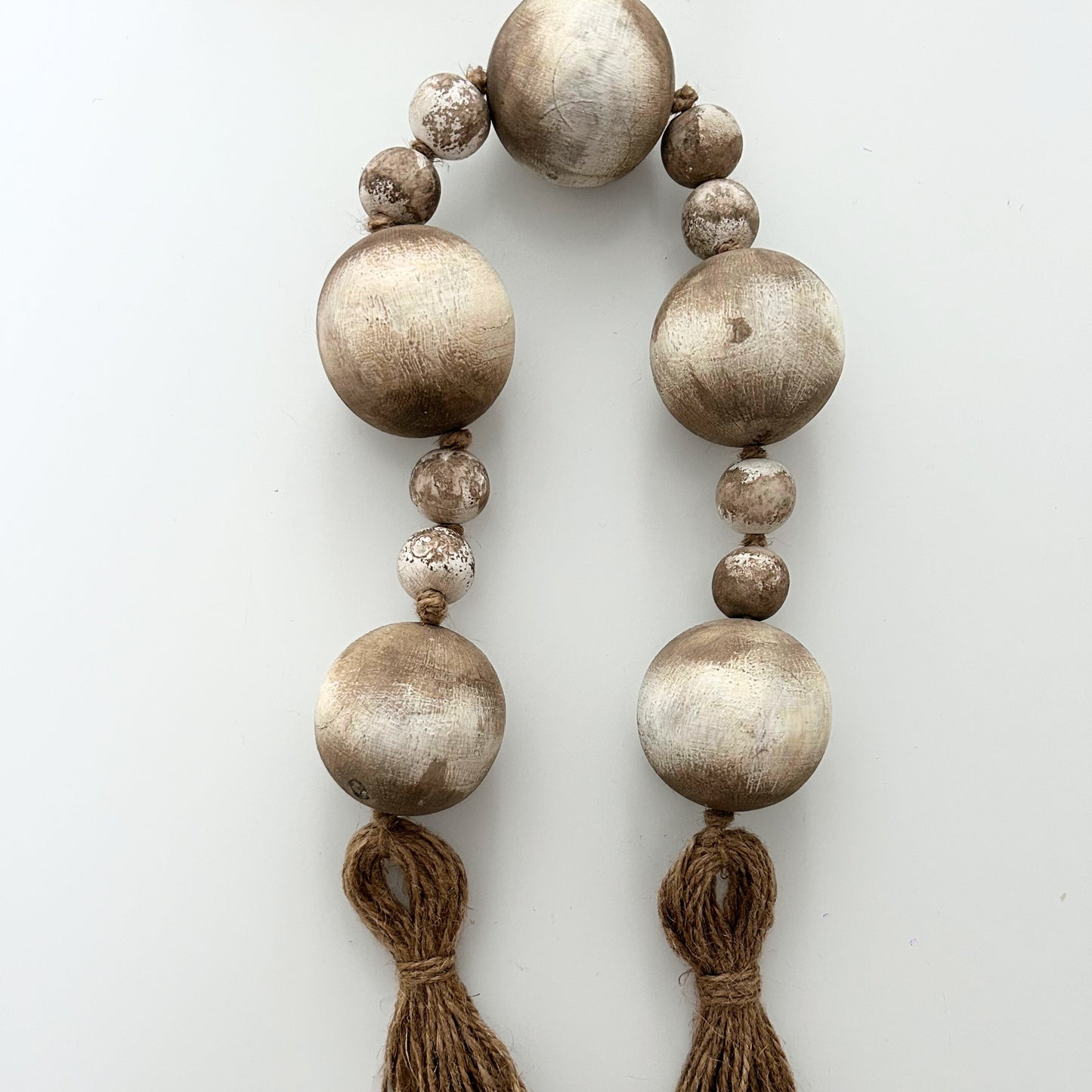 Sustainable decor piece with large beads and natural jute