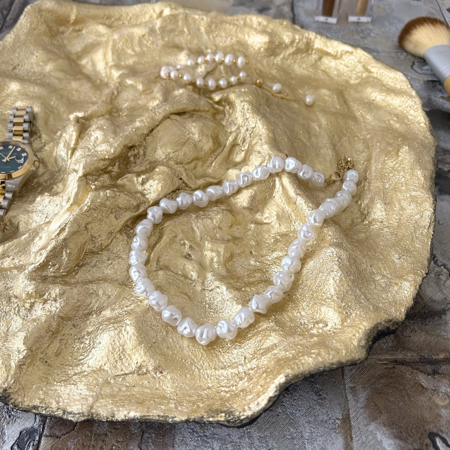 Golden summer tray with pearls, highlighting hand-sculpted details