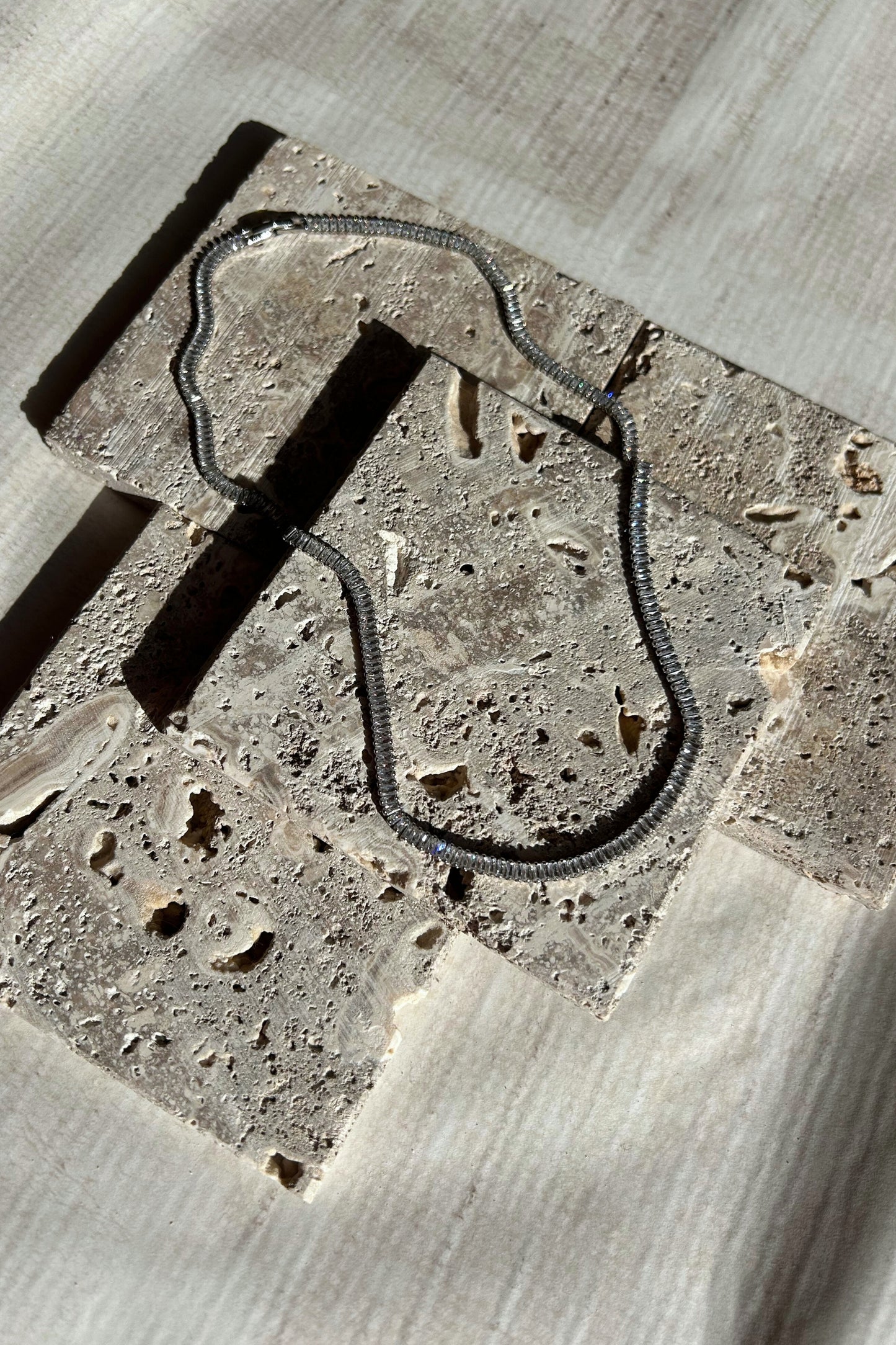 Travertine blocks arranged in layered style for product photography