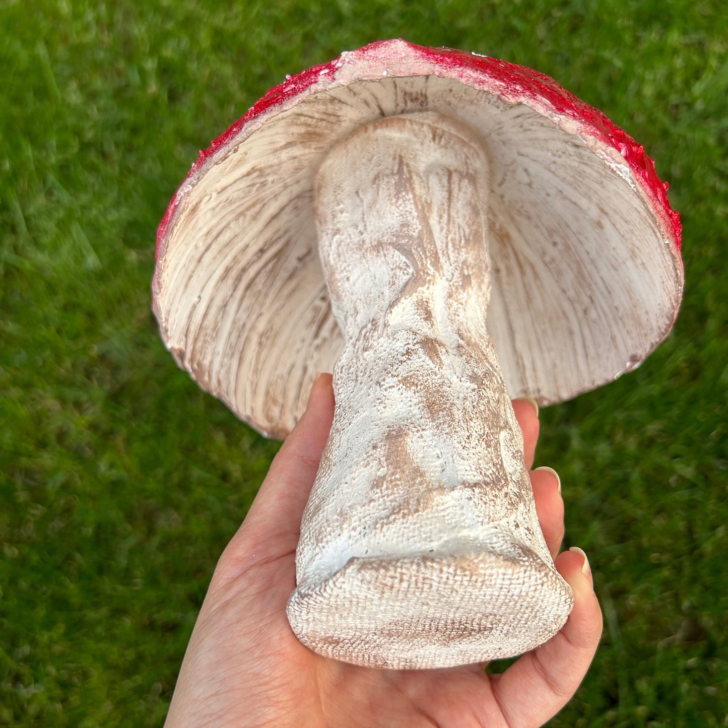 Close-up view of handmade mushroom showing textured cap and stalk details