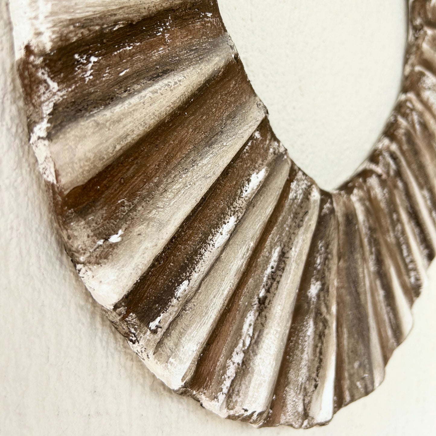 Oval handmade wall sculpture with textured ridges and bronze highlights, wabi sabi decor