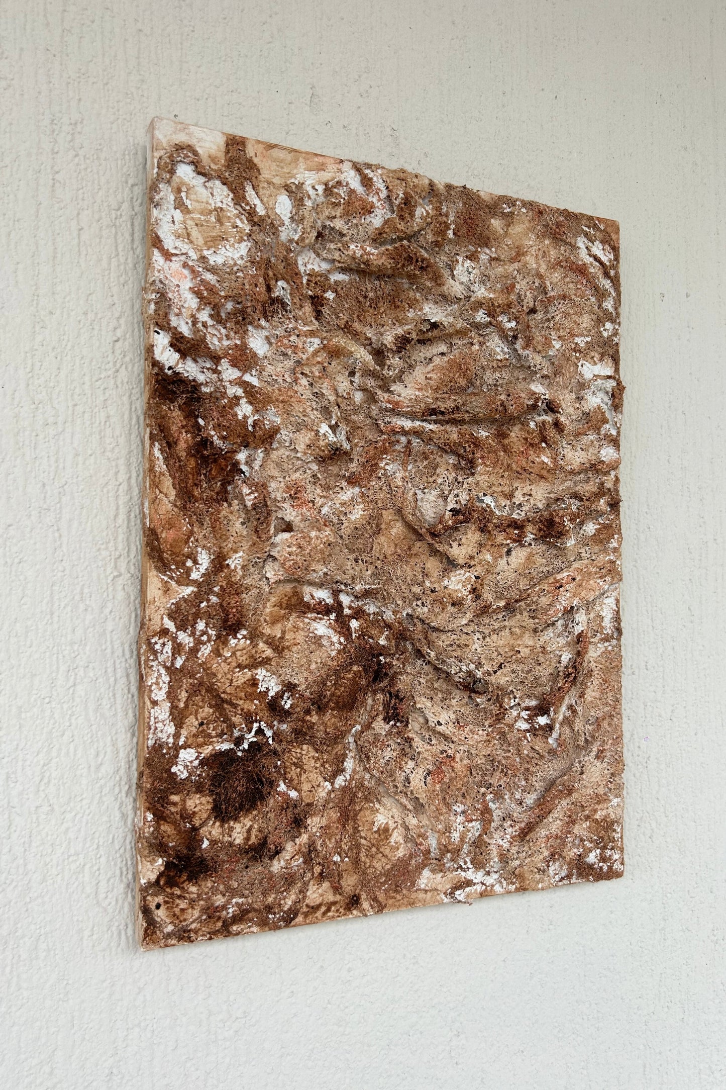 Side angle of textured canvas artwork showing the layered 3D depth and structure.