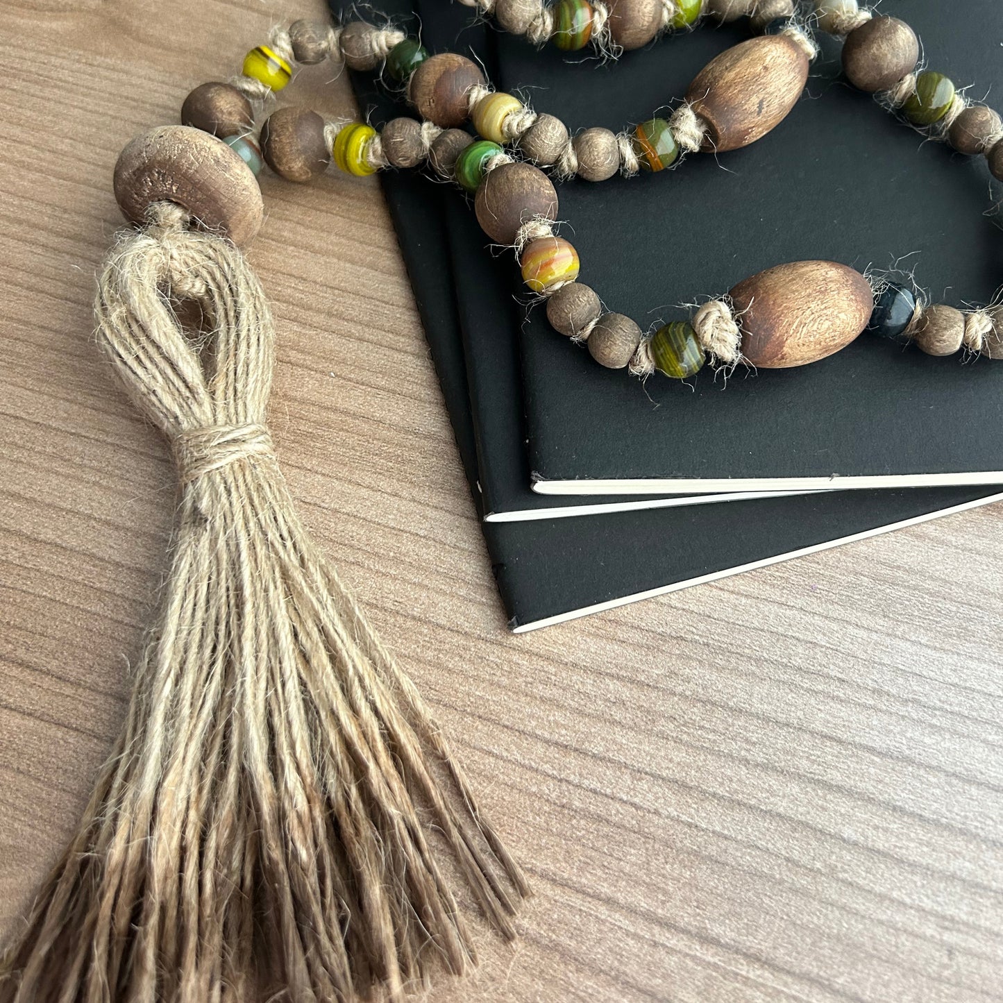 Eco-friendly garland resting on stacked books for a cozy rustic look