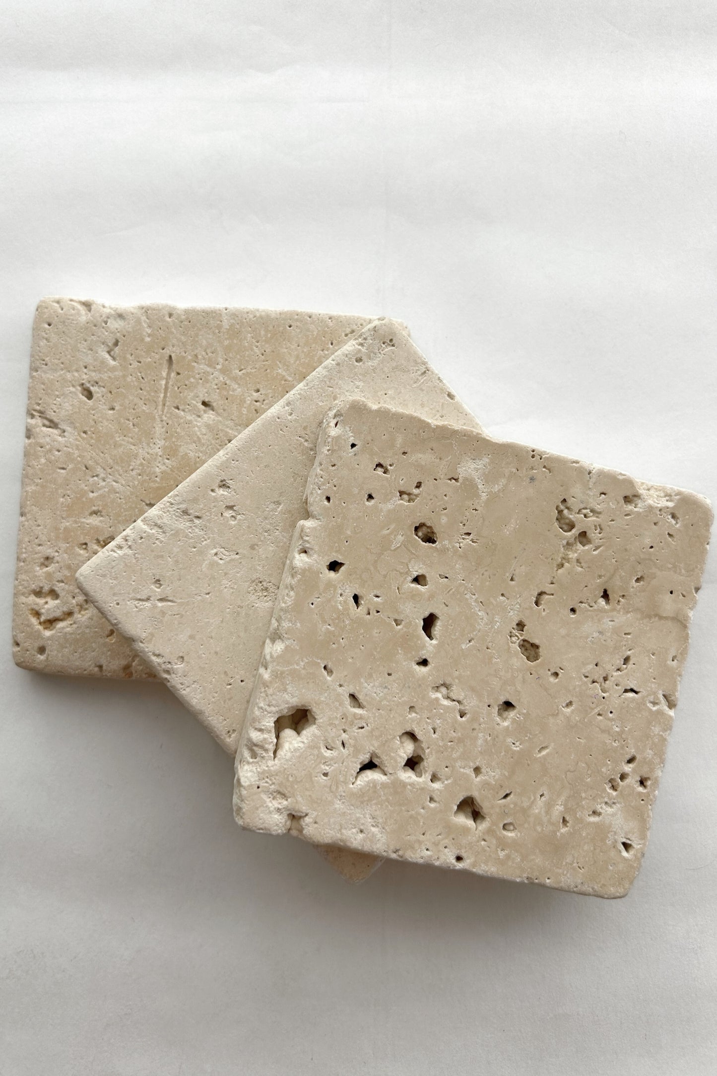 Pair of hand-cut travertine stone squares for product styling or shelf decor