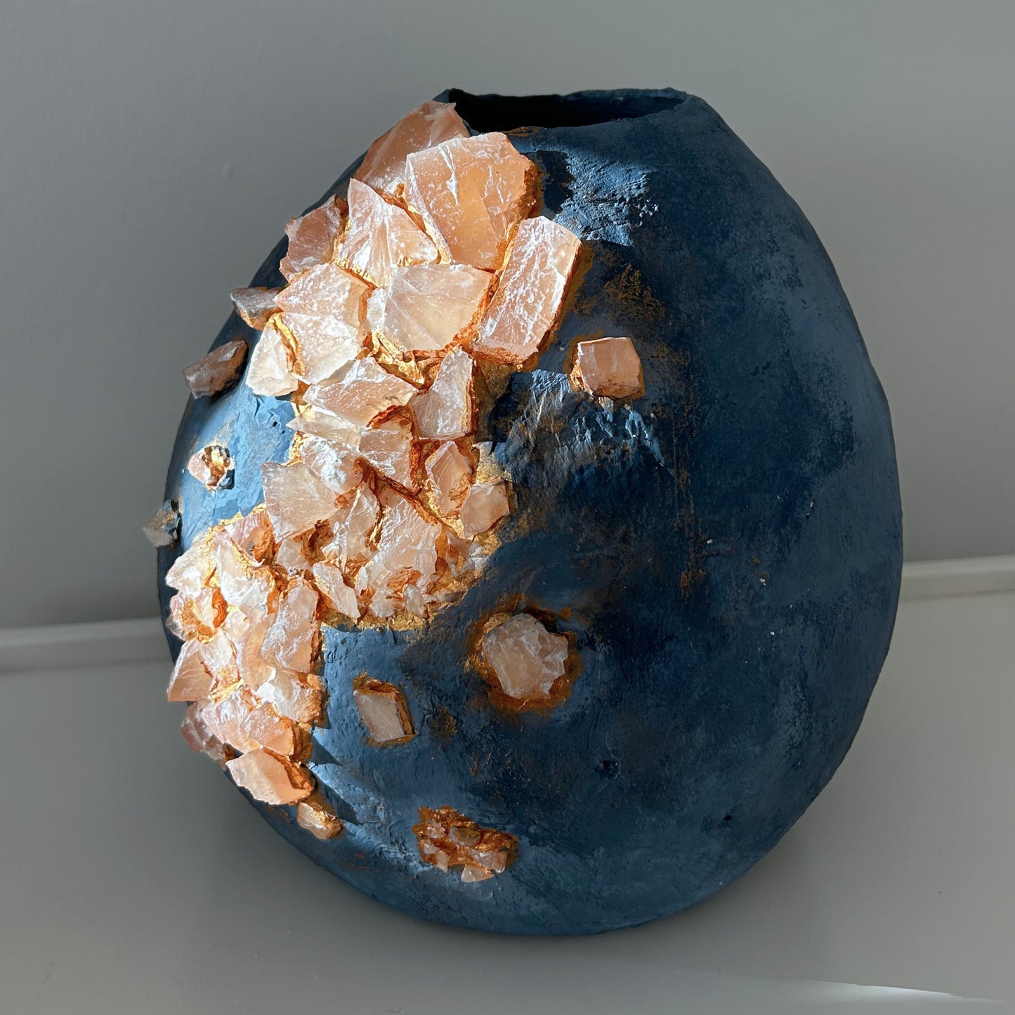 Front view of handmade wabi-sabi blue vase with natural marble stone accents