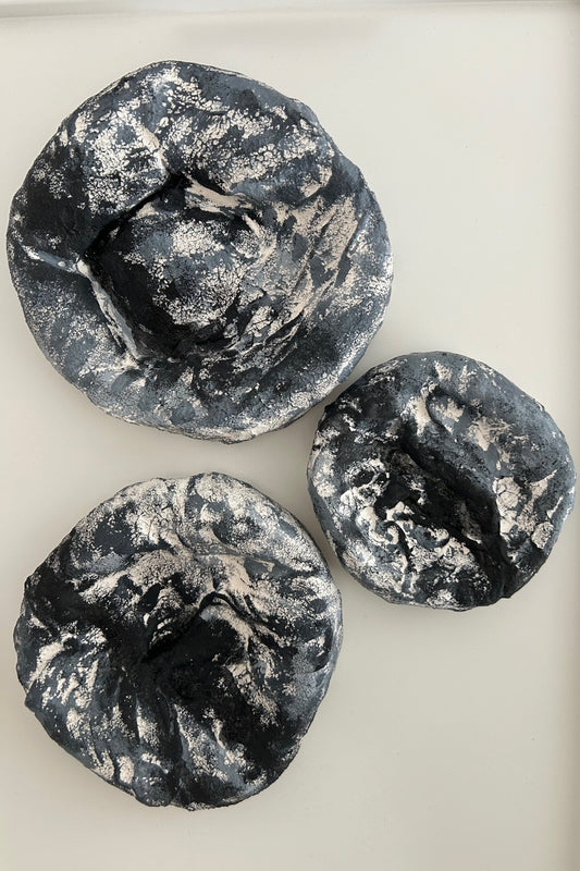 Three handmade wall sculptures displayed together on white background