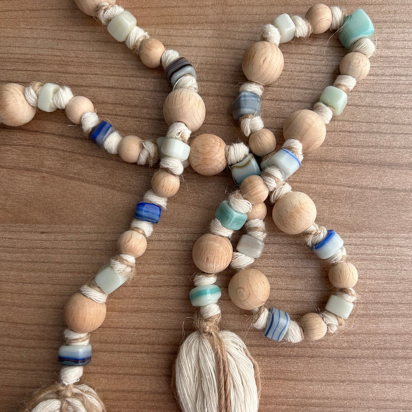 Earthy garland with large wooden bead focal points and textured glass beads.