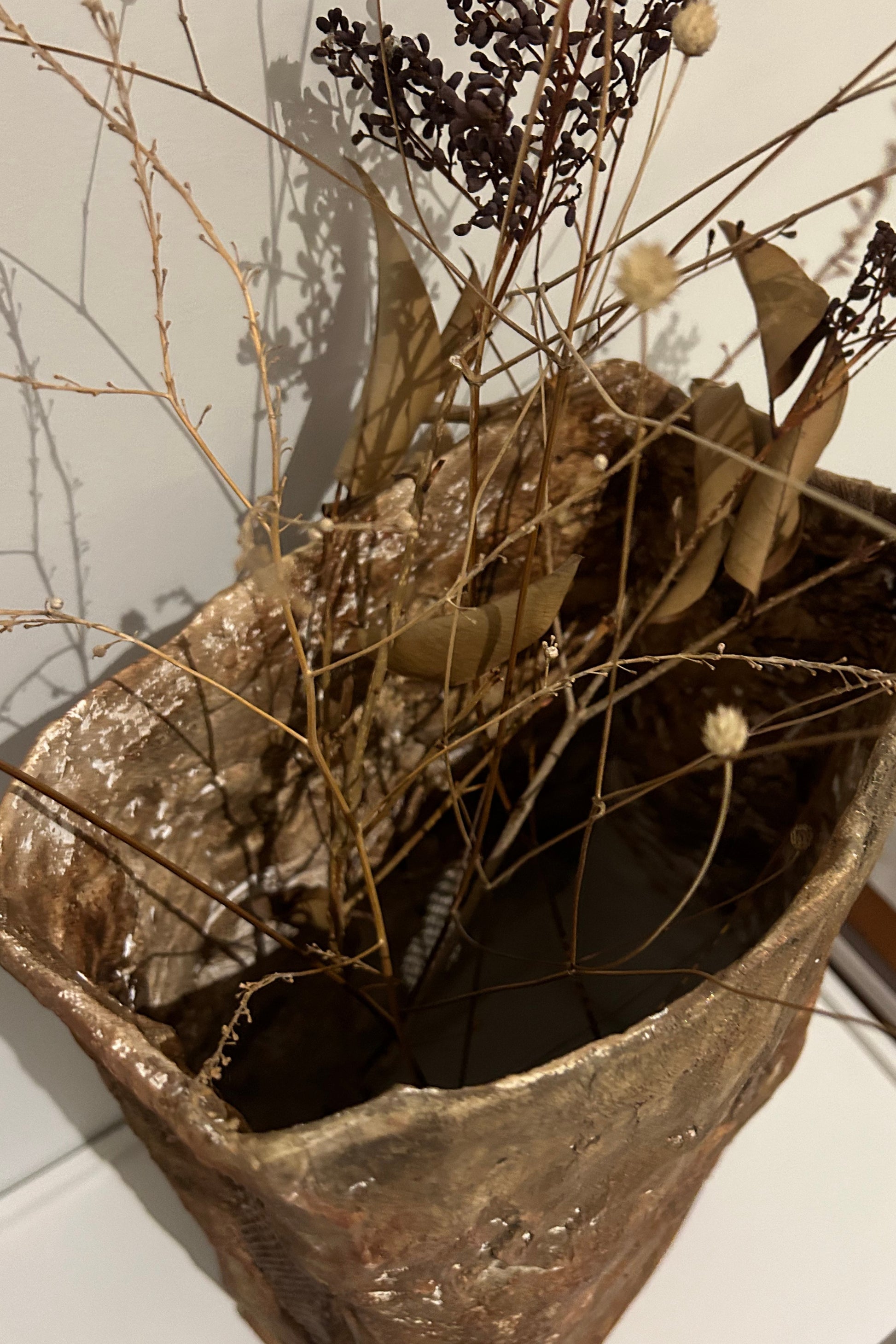 Top-down view showing wide mouth of organic textured vase
