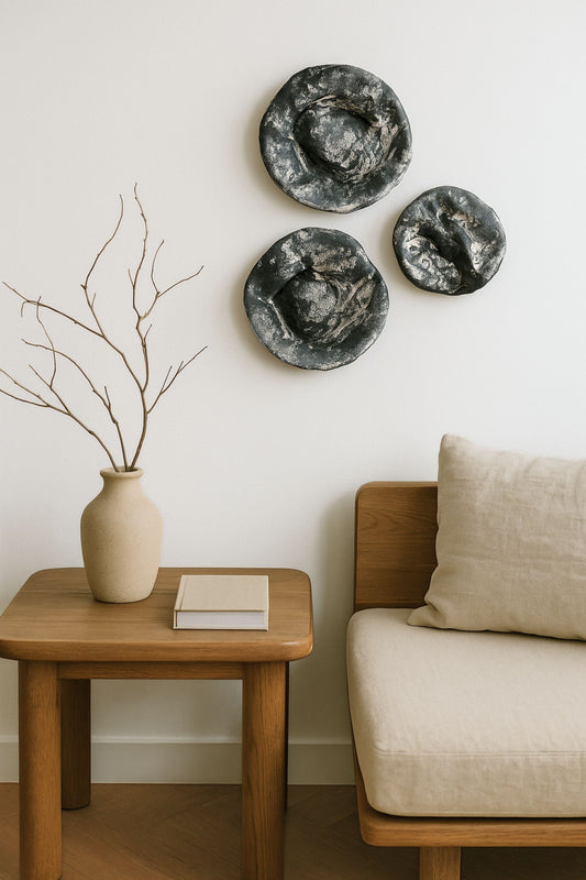 Japandi-style living room with three round textured wall art pieces on the wall