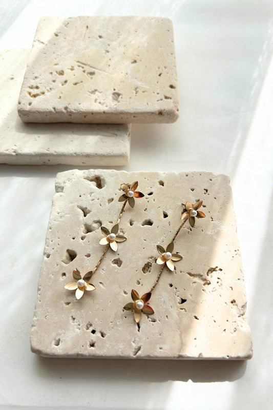Minimal travertine blocks in soft beige tones used for jewelry flatlay styling