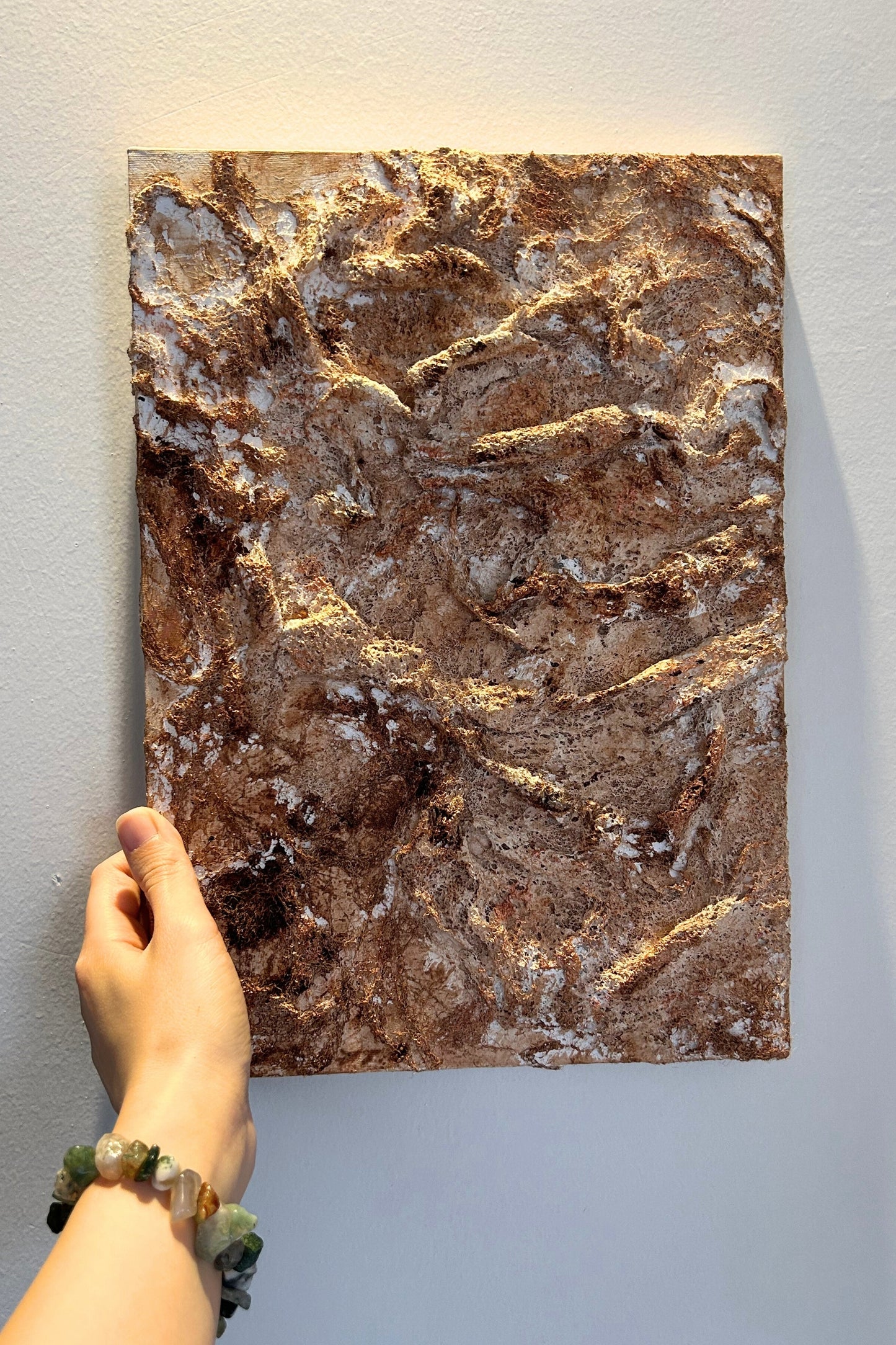 Hand holding the vertical 3D Wabi Sabi canvas showing its size and lightness.