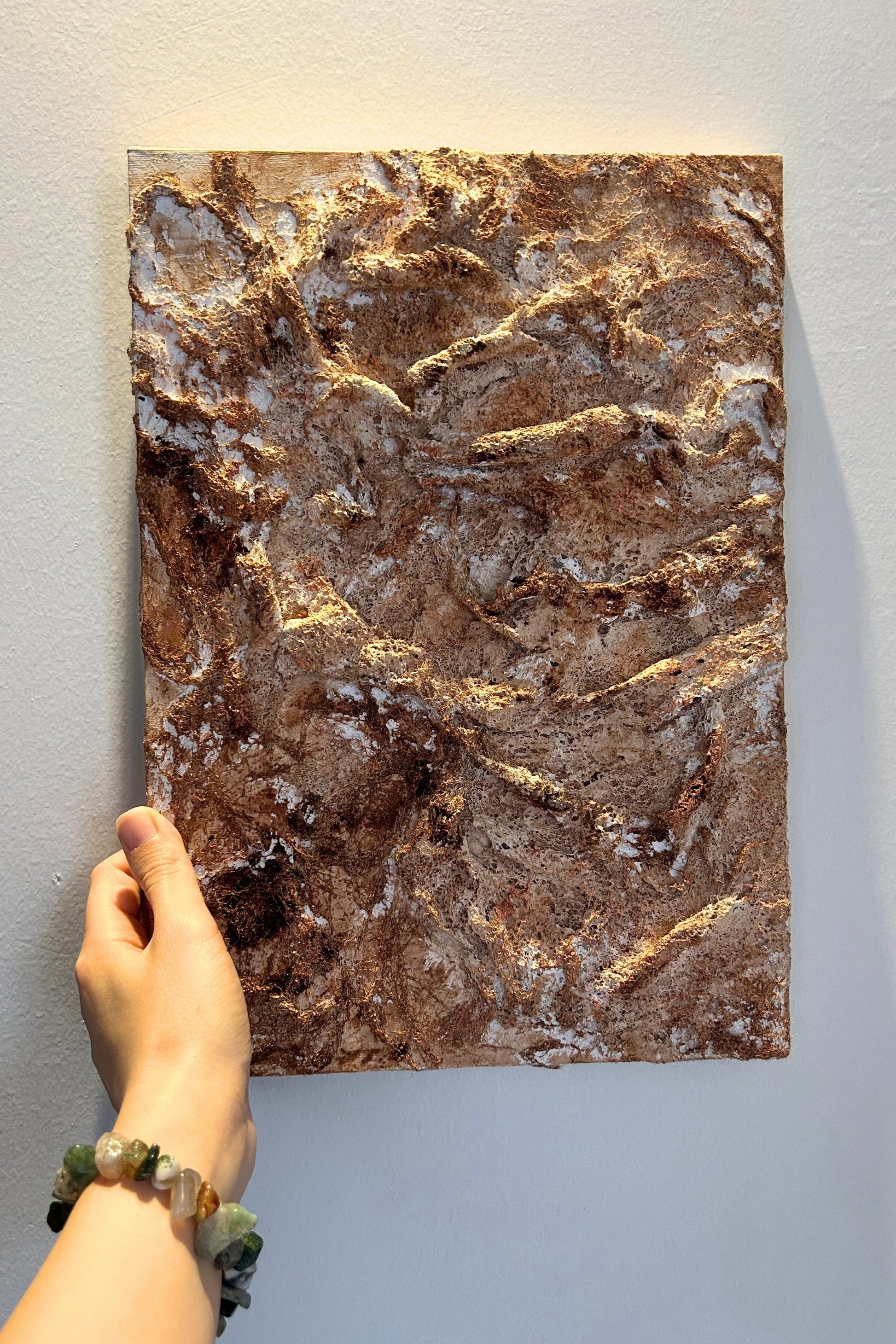 Hand holding the vertical 3D Wabi Sabi canvas showing its size and lightness.