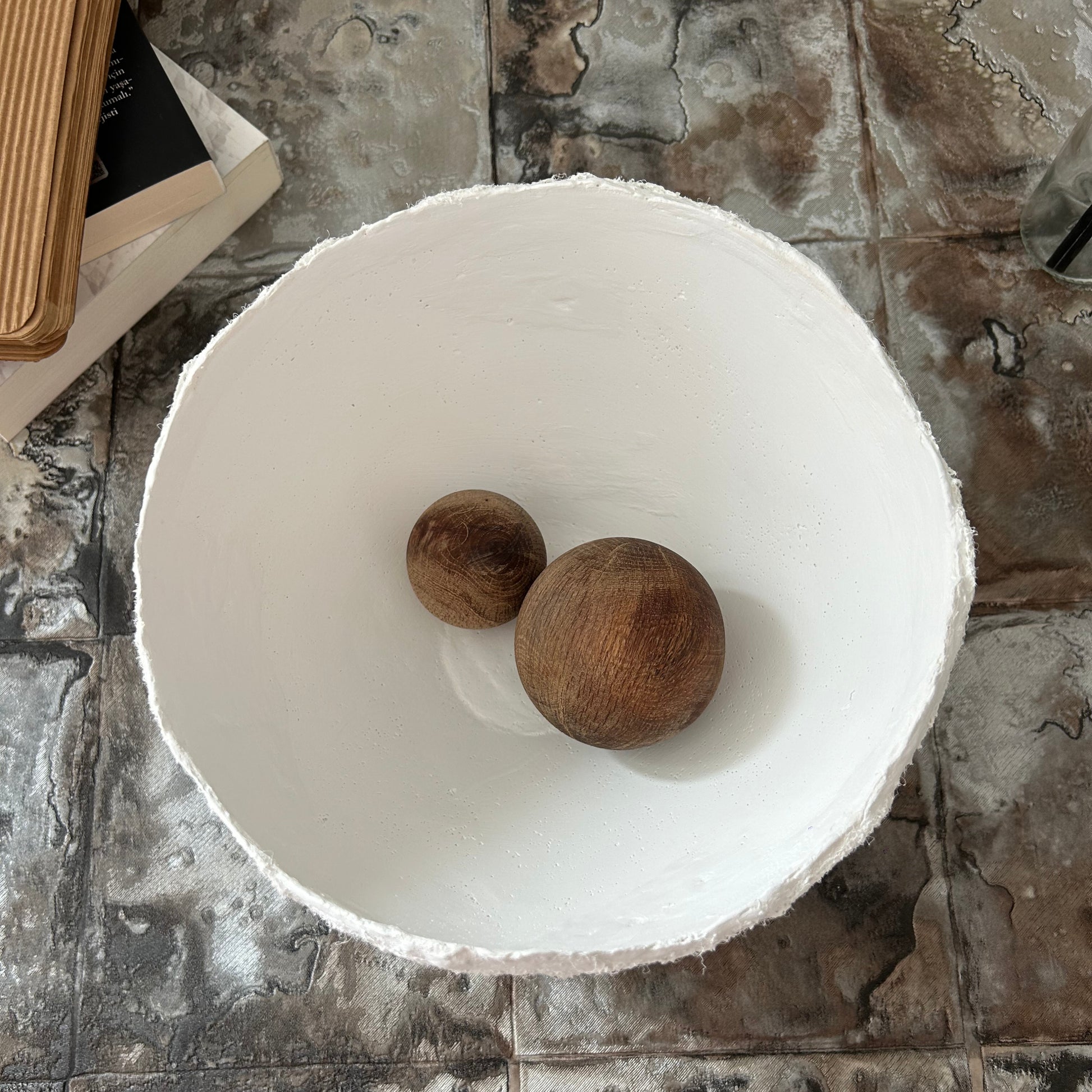 Top-down view of minimalist white decor bowl used as a small centerpiece or trinket holder