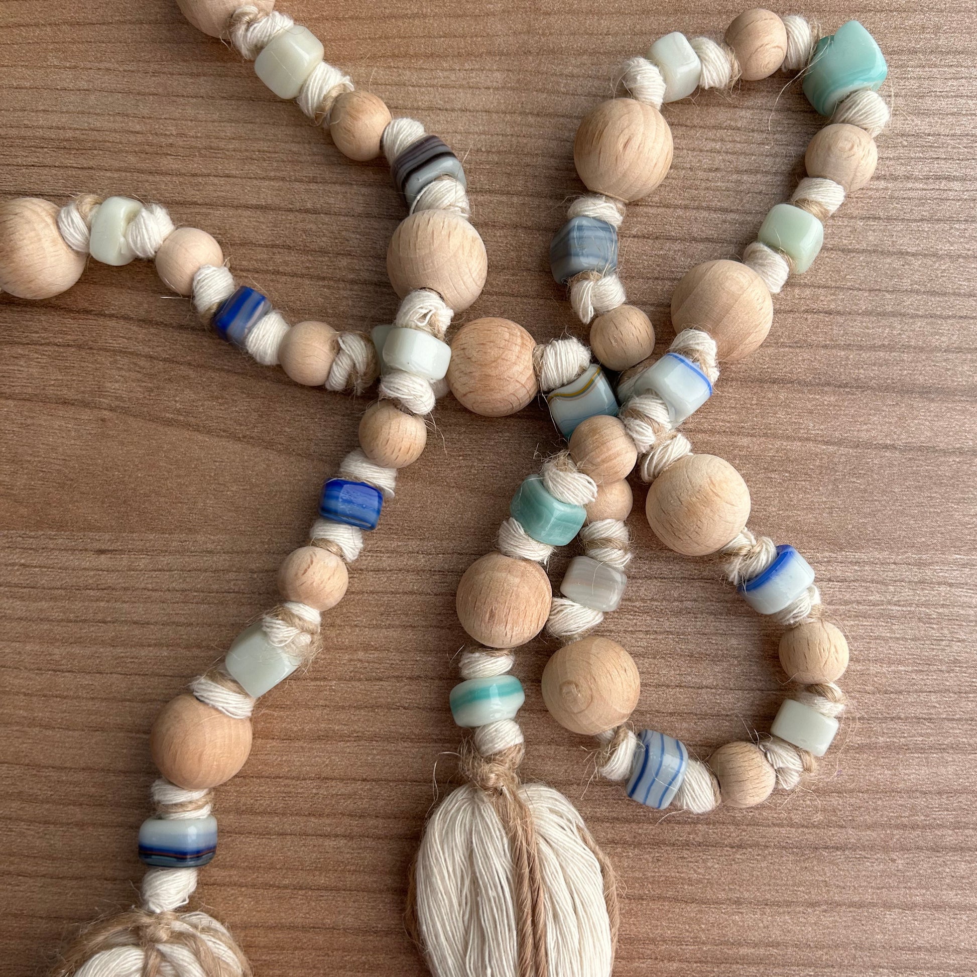 Earthy garland with large wooden bead focal points and textured glass beads.